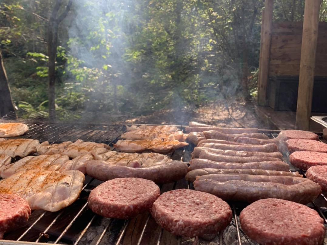 Selection of meats grilling on the BBQ
